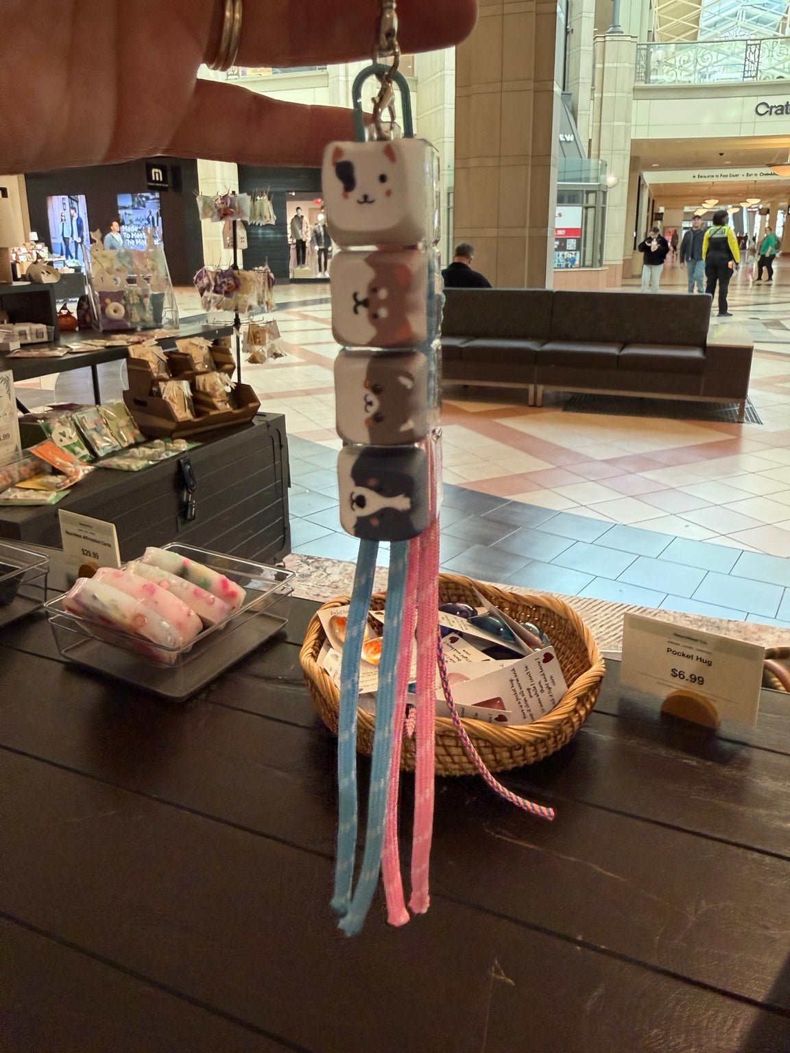 Kitty Clicker keychain hanging at the NeuroNest pop-up