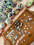 Personalized NeuroNest clicker keychains with names and colorful keycaps