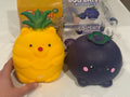 Unboxed pineapple and blueberry squishies included in the gift set; outer gift box not pictured